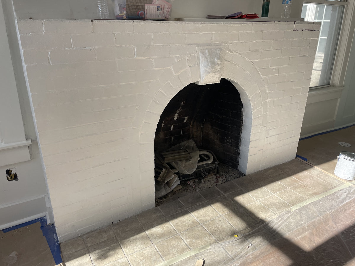 Painted white brick fireplace by Cardinal Painting Services