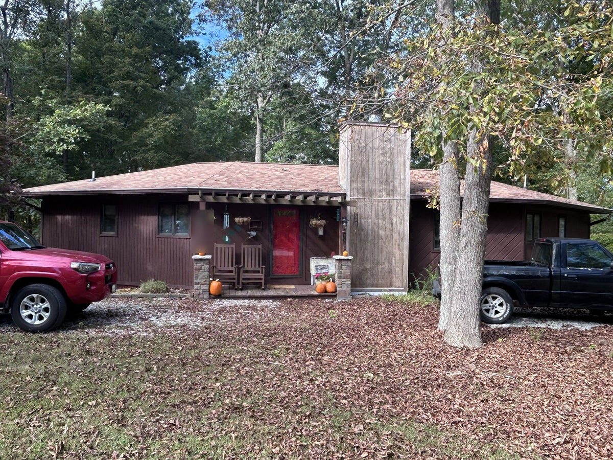 Brown ranch house before exterior painting