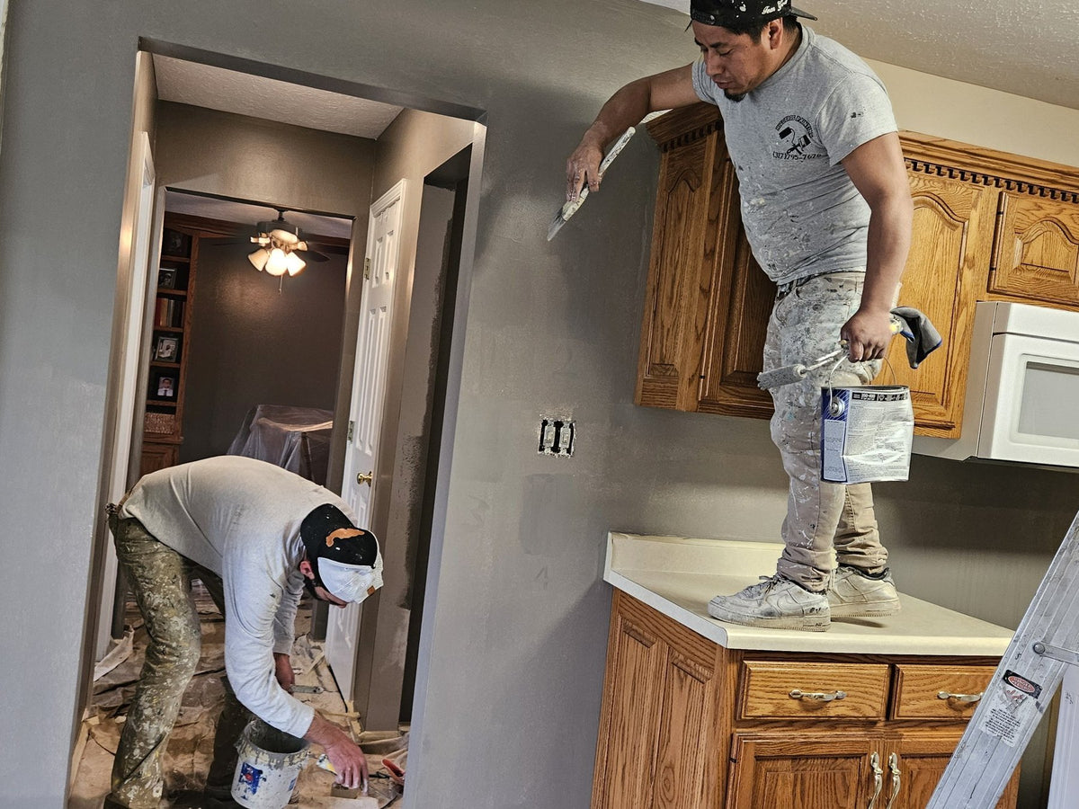 Cardinal Painting Services crew painting a kitchen