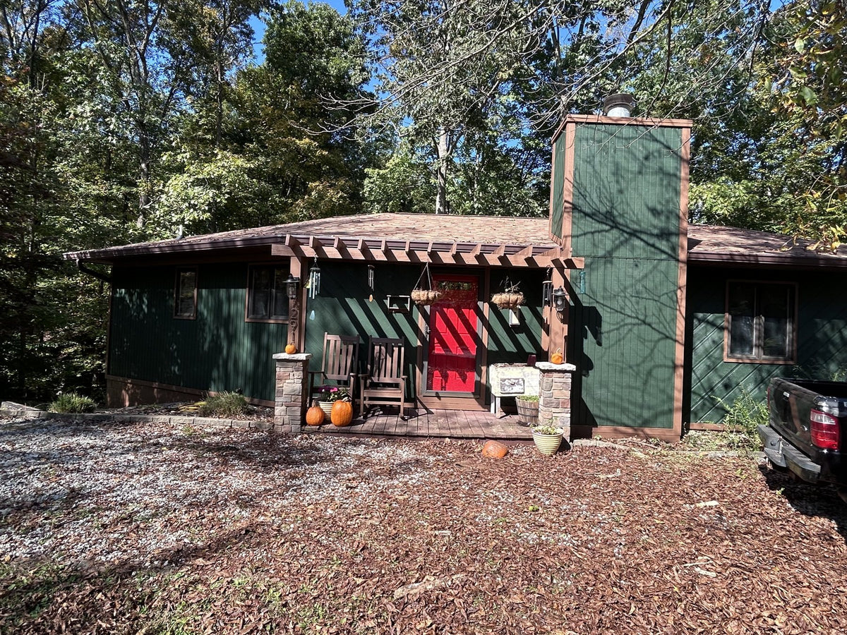 Ranch house painted green by Cardinal Painting Services